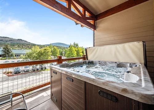 New Listing! River's Edge Condo - Private Hot Tub - Deck - Ideal Location