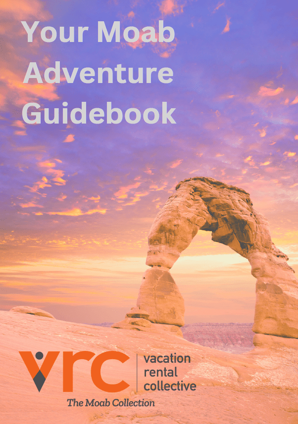 Cover of the Moab Adventure Guidebook from Vacation Rental Collective, featuring red rock arches under a desert sky